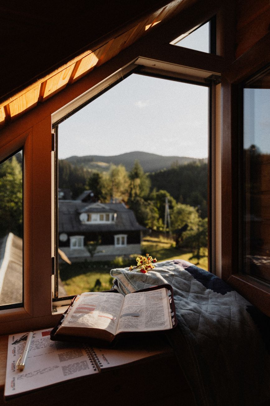 Architectural travel journal desk overlooking mist
