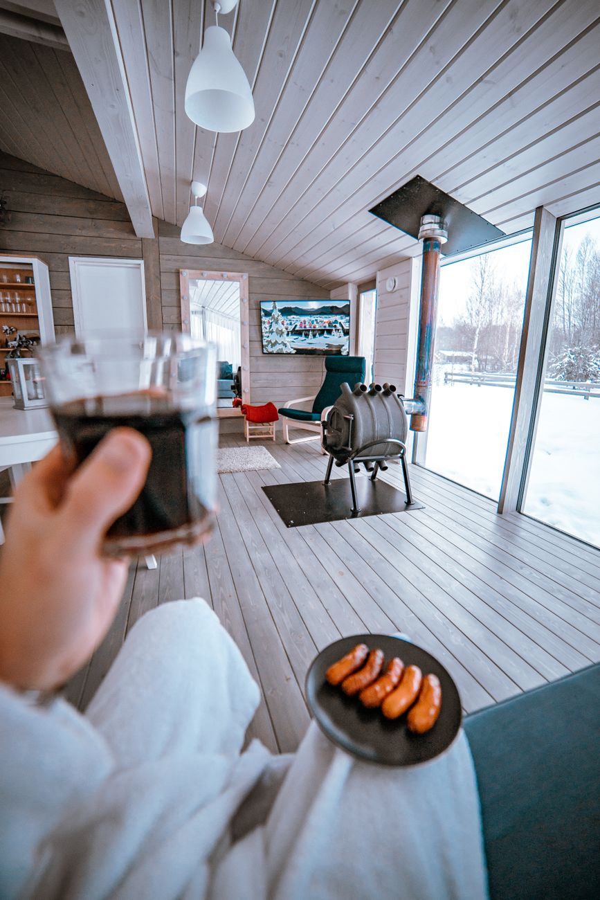 Scandinavian timber cabin overlooking cold lake